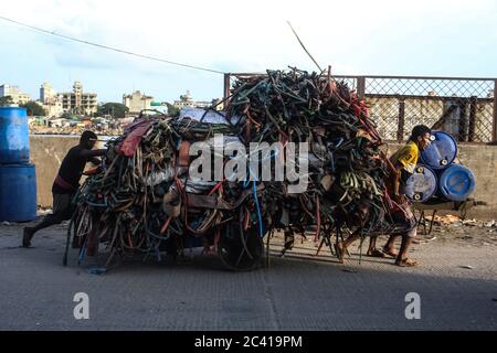 Dhaka, Dhaka, Bangladesh. 23rd June, 2020. Labors are carrying plastic wastages to a plastic recycling factory during the COVID-19 pandemic. Credit: Md. Rakibul Hasan/ZUMA Wire/Alamy Live News Stock Photo