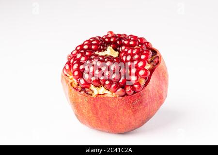 Fresh and delicious Pomegranate isolated on white Stock Photo