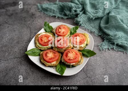 Fried zucchini with tomato dill mayonnaise and garlic sauce. Russian, European appetizer Stock Photo