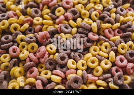 Multi-colored corn rings for breakfast, texture background. Stock Photo