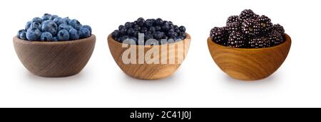 Black-blue berries isolated on white background. Collage of berries. Blueberry, bilberry, blackberry. Collection of fruits and berries in a bowl. Stock Photo