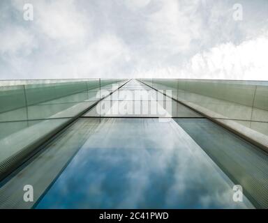 Modern glass office building agaist the cloudy sky Stock Photo - Alamy