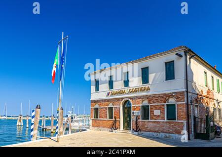 Chioggia, Italy, September 16, 2019: Italian coast guard building Capitaneria di Porto Guardia Costiera Comando COMPAMARE near embankment of lagoon, Veneto Region Stock Photo