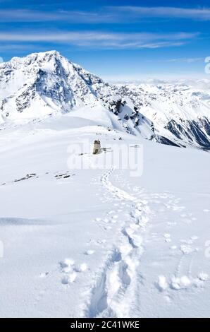 footprints and tracks in the snow in the high mountains Stock Photo - Alamy