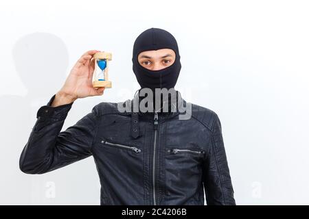 Bandit in black mask with hourglass isolated Stock Photo