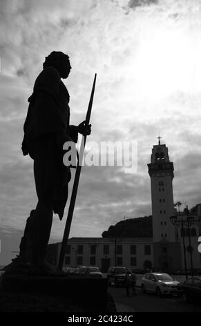 A backlight of the statue of a king of the Guanches in the square of the Patroness of the Canary Islands in the city of La Candelaria. Black and white Stock Photo