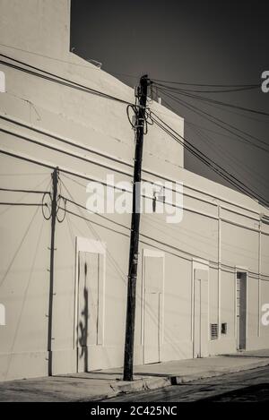 Utility pole in a sunny street, Merida, Mexico Stock Photo
