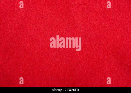 The texture of the red fabric on the Santa hat. New Year and Christmas background. Stock Photo