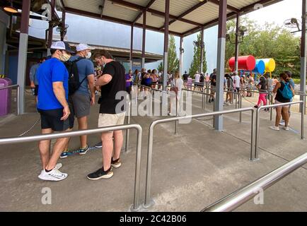Orlando, FL/USA - 6/13/20:  People in line for the Spiderman ride at Universal Studios during the reopening on June 2020 after the coronavirus wearing Stock Photo
