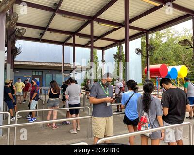 Orlando, FL/USA - 6/13/20:  People in line for the Spiderman ride at Universal Studios during the reopening on June 2020 after the coronavirus wearing Stock Photo