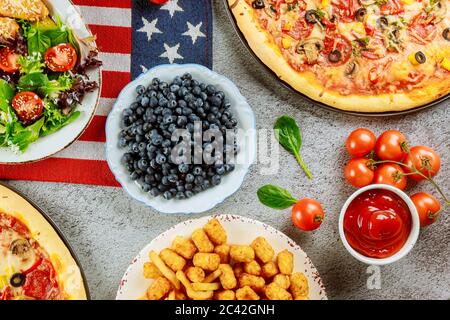 National party table with delicious food and flag for american holiday. Stock Photo