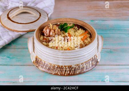 Delicious indian lunch with stewed rice ,meat and carrot in plate with flatbread. Stock Photo