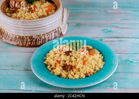Delicious lunch with stewed rice ,meat and carrot. Eastern food. Stock Photo