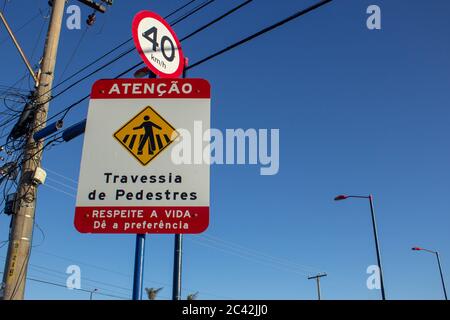 Speed sign showing 40kmh and an warning sign saying 'Atention, Pedestrian Crossing, Respect the life, give preference'. Stock Photo