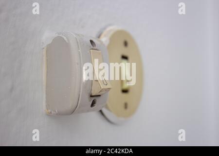 Old door bell switches very aged and dirty Stock Photo