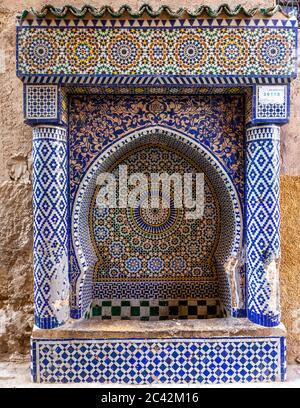 Water fountain in Fès decorated with mosaic. Impressions of Morocco Stock Photo