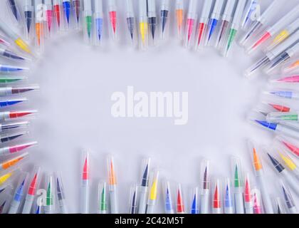 Frame made of many pens and markers of different colors  Stock Photo