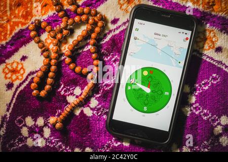 Digital Quran or Quran apps is used for muslim to read the text of Quran on an electronic device. Islamic flatlay concept Stock Photo