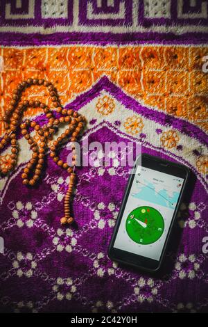 Digital Quran or Quran apps is used for muslim to read the text of Quran on an electronic device. Islamic flatlay concept Stock Photo