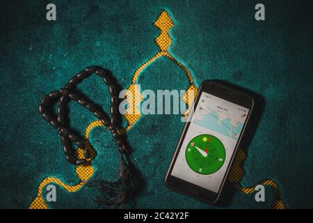 Digital Quran or Quran apps is used for muslim to read the text of Quran on an electronic device. Islamic flatlay concept Stock Photo