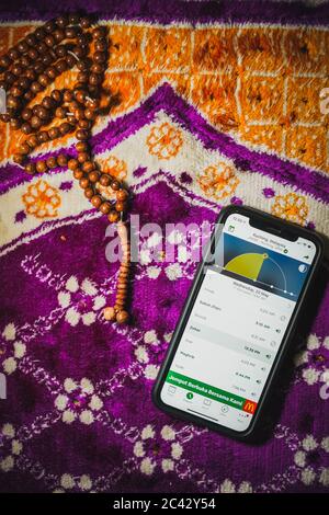 Digital Quran or Quran apps is used for muslim to read the text of Quran on an electronic device. Islamic flatlay concept Stock Photo