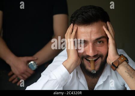 Young gambler man smiling and looking at camera Stock Photo
