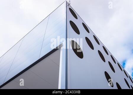 A modern office building with circular windows. Stock Photo