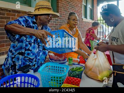 Vendors sell produce at the Clarksdale Farmers Market, Aug. 9, 2016, in Clarksdale, Mississippi.