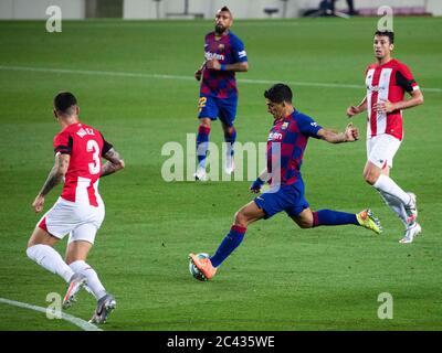 Barcelona, Spain. 23rd June, 2020. Barcelona's Luis Suarez (2nd R) shoots the ball during a Spanish league football match between Barcelona and Athletic Bilbao in Barcelona, Spain, June 23, 2020. Credit: Joan Gosa/Xinhua/Alamy Live News Stock Photo