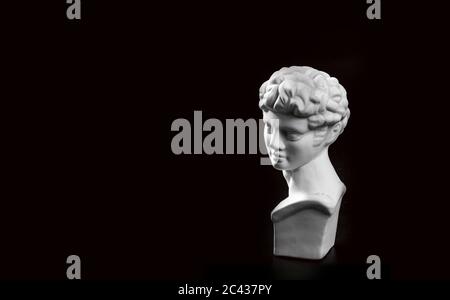 black background of David sculpture Stock Photo