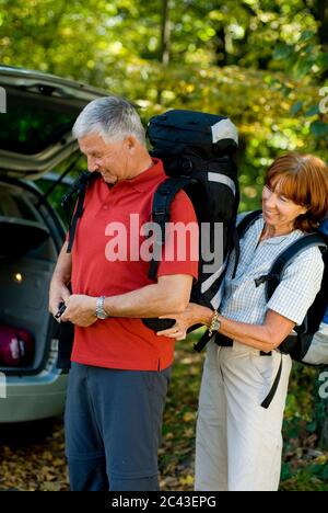 Mature couple is preparing for a hike, Munich, Bavaria, Germany Stock Photo