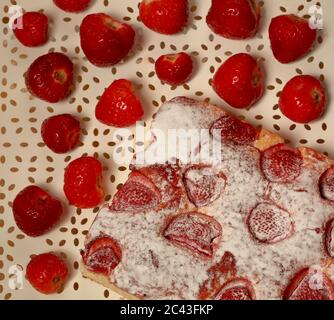 Stawberry cake on white decorative plate with fresh strawberries top view. Stock Photo