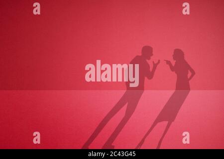 The shadow of a quarreling couple. fight between husband and wife. Stock Photo