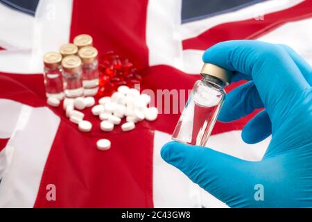 Medicine shortages, stockpile drugs and medical crisis as result of no deal brexit concept theme with doctor wearing latex gloves holding a vaccine Stock Photo