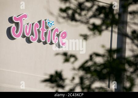 A logo sign outside of a Justice retail store location in Gambrills, Maryland on June 8, 2020. Stock Photo