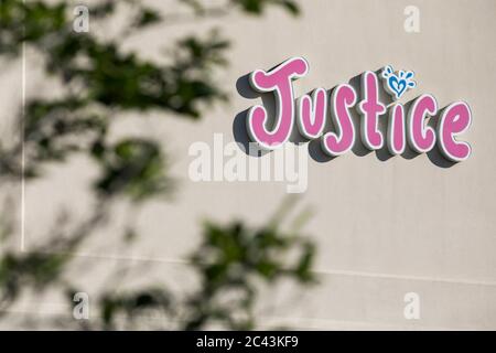 A logo sign outside of a Justice retail store location in Gambrills, Maryland on June 8, 2020. Stock Photo