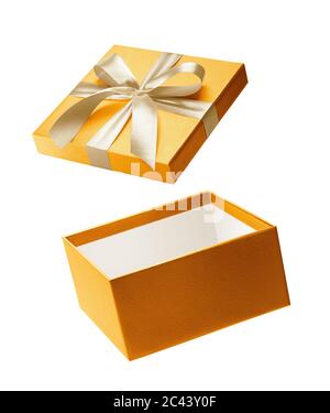 Gold color open gift box isolated on white background Stock Photo