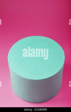 Round Box on pink background for gift. Stock Photo