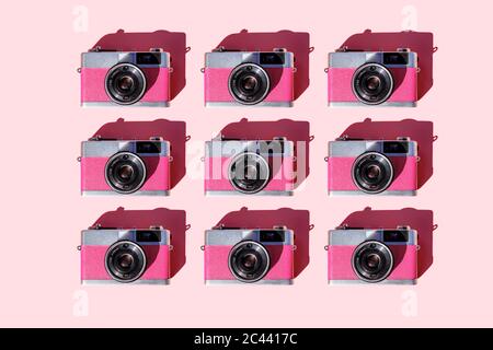 Pattern of rows of vintage analog cameras Stock Photo