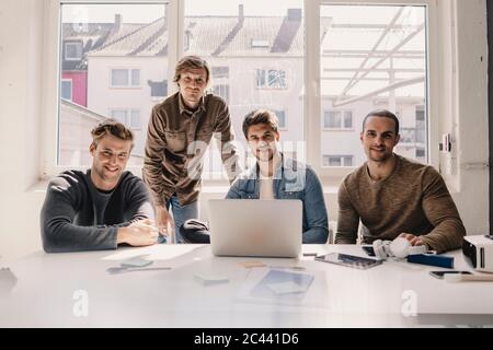 Young entrepreneurs having a meeting in their start up business Stock Photo