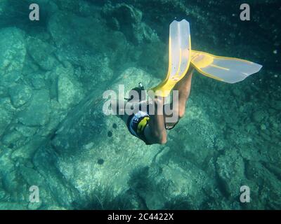 Spain, Catalonia, Cap de Creus, Man snorkeling in turquoise sea Stock Photo