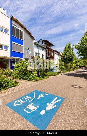 Germany, Baden-Wurttemberg, Freiburg im Breisgau, Children at play road marking in modern suburb Stock Photo