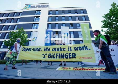 Mannheim, Germany. 24th June, 2020. Activists of the anti-nuclear organization '.broadcasted' hold a banner in front of the headquarters of the construction service provider Bilfinger with the inscription 'Super-GAU. We make it work. Bilfinger' in their hands. The protest is directed against the company's nuclear business. Bilfinger holds its online Annual General Meeting today. Credit: Uwe Anspach/dpa/Alamy Live News Stock Photo
