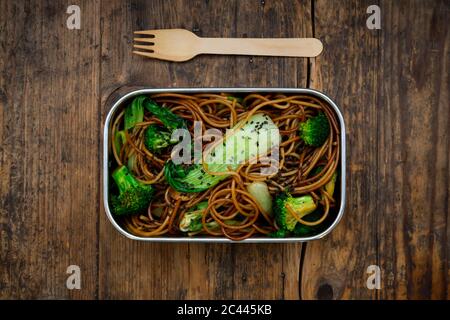 Lunch box of soba noodles with bok choy, broccoli, soy sauce and black sesame seeds Stock Photo