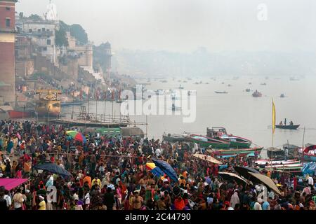 The image of Pilgrims at sunrise on the Ghats or holy steps of Varanasi, Ganges, Uttar Pradesh, India, Asia Stock Photo