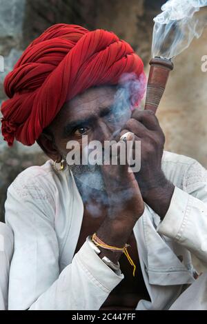 The image of Shepherds smoking  in the village of Jawai-Bera, Rajasthan, India, asia Stock Photo