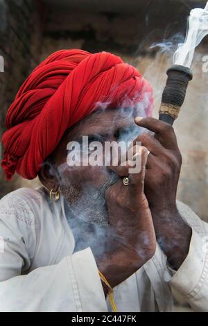 The image of Shepherds smoking  in the village of Jawai-Bera, Rajasthan, India, asia Stock Photo