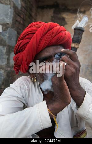 The image of Shepherds smoking  in the village of Jawai-Bera, Rajasthan, India, asia Stock Photo
