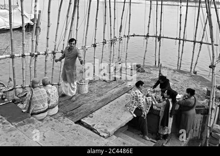 The image of Devotees preparing for dev deepavali festival at the Ghats or holy steps of Varanasi, Ganges, Uttar Pradesh, India, Asia Stock Photo