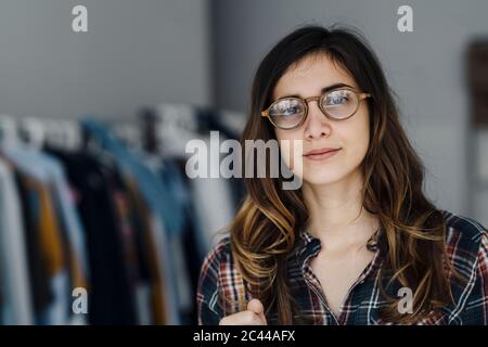Portrait of young fashion designer in a loft Stock Photo